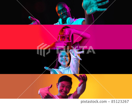 Collage of young cheerful people, boys and girls making camera hands isolated over multicolored background in neon lights 85123267