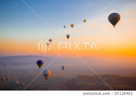 GOREME, TURKEY - SEPTEMBER 18. 2021: Bright hot air balloons in sky of Cappadocia, Turkey GOREME, TURKEY - SEPTEMBER 18. 2021: Bright hot air balloons in sky of Cappadocia, Turkey 85126461