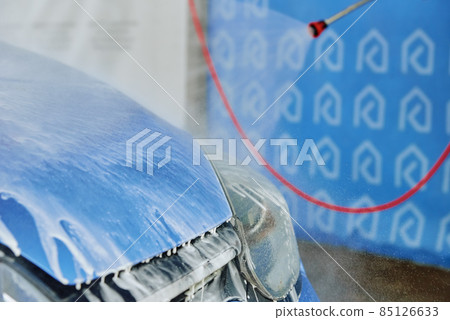 Cleaning car with high pressure water at car wash station Cleaning car with high pressure water at car wash station 85126633
