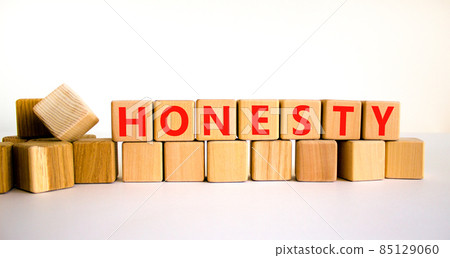 Honesty symbol. The concept word Honesty on wooden cubes. Beautiful white table, white background, copy space. Business and honesty concept. 85129060
