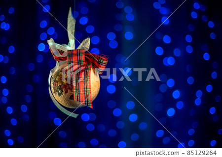 Beautiful Christmas balls on a white Christmas tree with decorations for Merry Christmas and Happy New Year Beautiful Christmas balls on a white Christmas tree with decorations for Merry Christmas and Happy New Year 85129264
