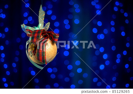 Beautiful Christmas balls on a white Christmas tree with decorations for Merry Christmas and Happy New Year Beautiful Christmas balls on a white Christmas tree with decorations for Merry Christmas and Happy New Year 85129265