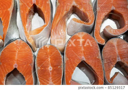 Salmon steaks fish closeup in a market Salmon steaks fish closeup in a market 85129317