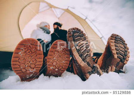 close up male and female winter shoes. close up male and female winter shoes. 85129886