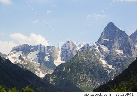 The Caucasus Mountains. Mountain peaks in summer. 85129941