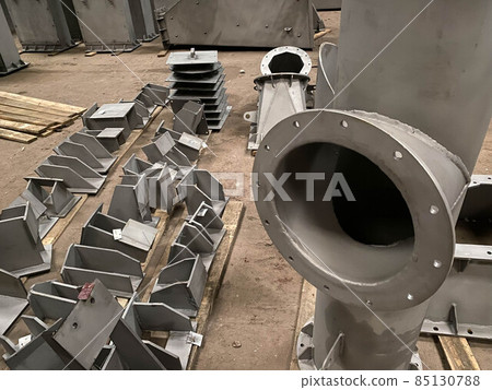 Industrial background, heavy metal housing with welded metal flanges. Shallow depth of field Industrial background, heavy metal housing with welded metal flanges. Shallow depth of field 85130788