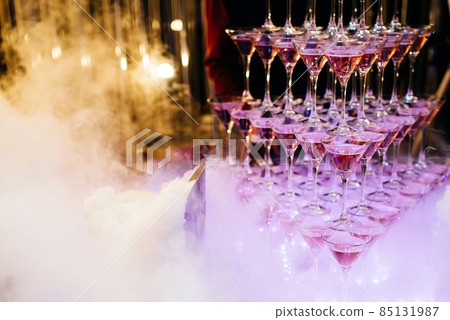 Beautiful Pyramid of Delicious Alcohol Crystal Glass with Champagne. Romantic Celebrations and Party Concept 85131987