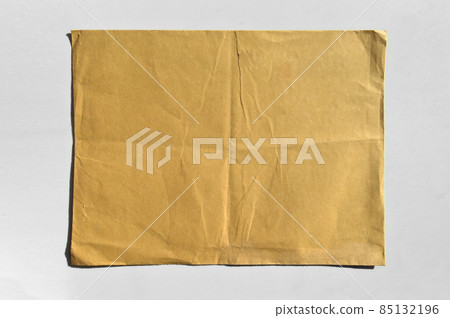 Brown and beige cardboard paper mail envelope on a white background Brown and beige cardboard paper mail envelope on a white background 85132196
