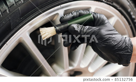 man cleaning car rims. High quality photo 85132756