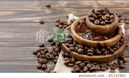 front view coffee beans wooden table. High quality photo front view coffee beans wooden table. High quality photo 85132962