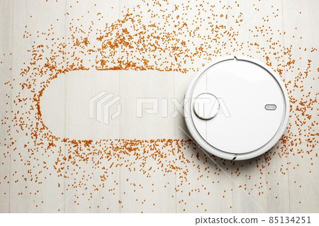 flat lay wireless controlled vacuum cleaner. High quality photo 85134251