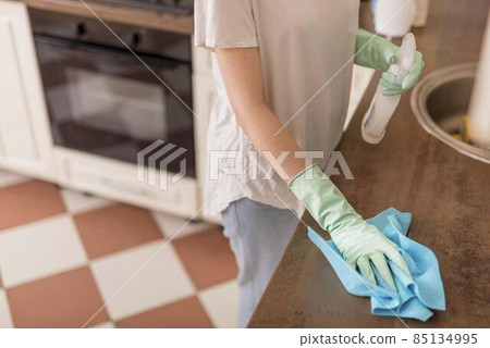 side view woman cleaning kitchen surface. High quality photo side view woman cleaning kitchen surface. High quality photo 85134995