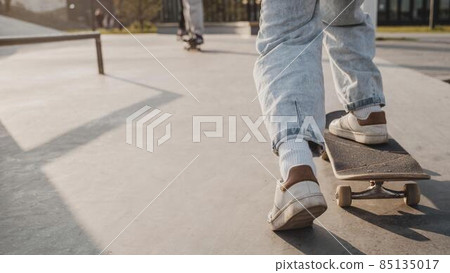 back view teenager with skateboard copy space skatepark. High quality photo back view teenager with skateboard copy space skatepark. High quality photo 85135017