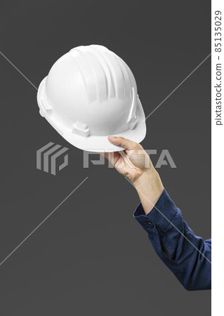 portrait female engineer holding helmet close up. High quality photo portrait female engineer holding helmet close up. High quality photo 85135029