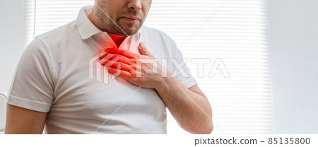 The young man is suffering from heartburn. Disease of the gastrointestinal tract. Sore throat. The young man is suffering from heartburn. Disease of the gastrointestinal tract. Sore throat. 85135800