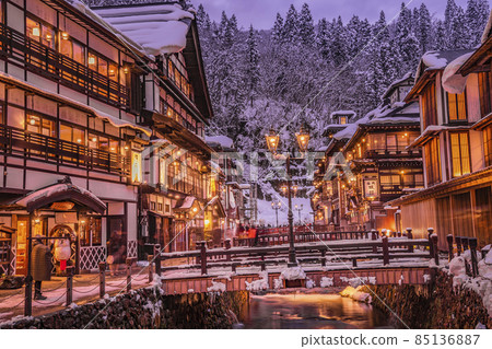 Scenery of Ginzan Onsen Obanazawa City, Yamagata Prefecture, on a winter night with snow Scenery of Ginzan Onsen Obanazawa City, Yamagata Prefecture, on a winter night with snow 85136887