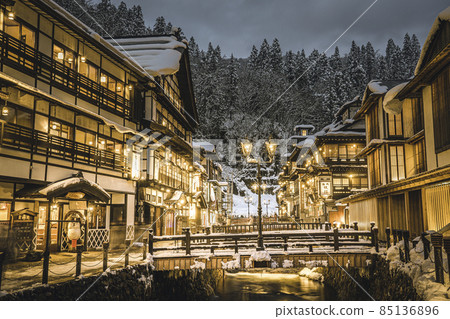 Scenery of Ginzan Onsen Obanazawa City, Yamagata Prefecture, on a winter night with snow Scenery of Ginzan Onsen Obanazawa City, Yamagata Prefecture, on a winter night with snow 85136896