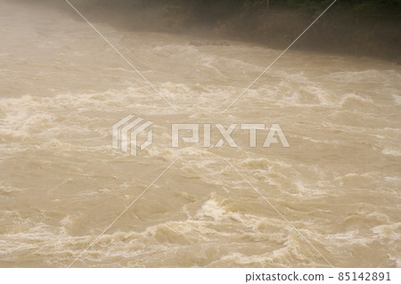 Muddy stream of the Hida River 85142891