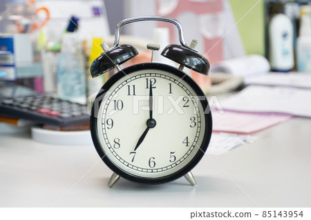 the clock on work desk in the office Time of businessman working concepts the clock on work desk in the office Time of businessman working concepts 85143954