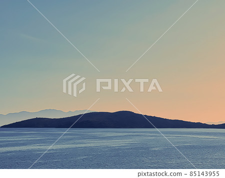 Vintage seascape and coastal nature background. Blue sea and mountains in the morning as art print Vintage seascape and coastal nature background. Blue sea and mountains in the morning as art print 85143955