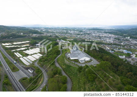 Aerial view of the streets of Komoro city in early summer 85144312