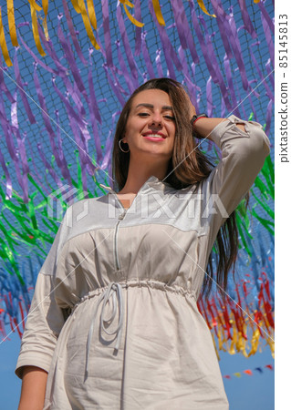 Young woman on festival. Gen z girl enjoying outdoors, expressing positive emotions having fun in park. Millennial generation lifestyle. Young woman on festival. Gen z girl enjoying outdoors, expressing positive emotions having fun in park. Millennial generation lifestyle. 85145813
