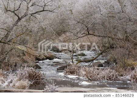 Beautiful winter landscape with Girskiy Tikych river running through frosted trees and rocks. Beautiful winter landscape with Girskiy Tikych river running through frosted trees and rocks. 85146029