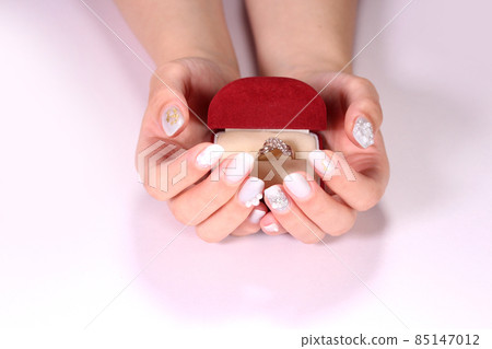 Female hand with a ring Female hand with a ring 85147012