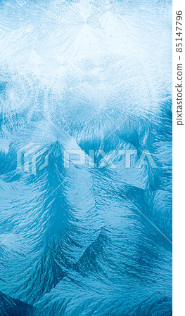 Winter background and Christmas art concept. Ice frost on frozen window glass with natural frosty pattern and texture design as holiday card backdrop 85147796