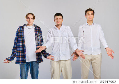Three surprised men make a helpless gesture Three surprised men make a helpless gesture 85147902