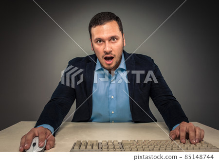 Portrait young man in blue shirt, looking with amazement 85148744