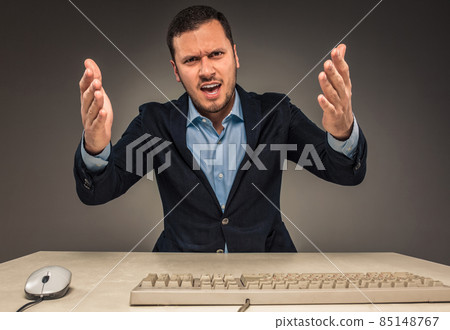 Portrait angry upset young man in blue shirt and jacket 85148767