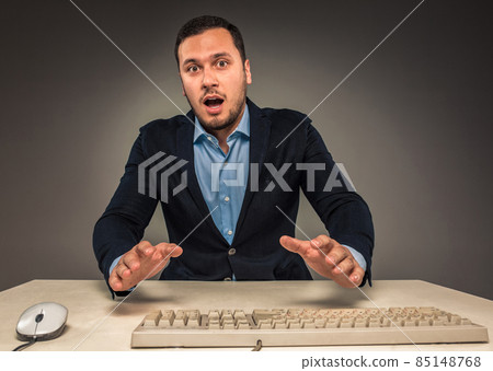 Portrait young man in blue shirt, looking with amazement 85148768
