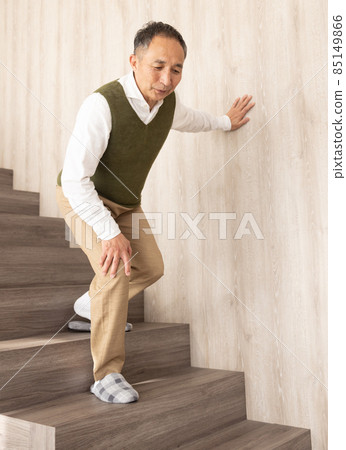 Senior men getting off the stairs 85149866