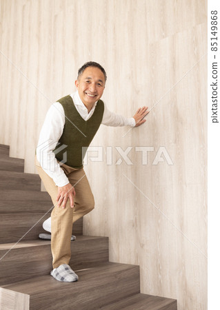 Senior men getting off the stairs 85149868