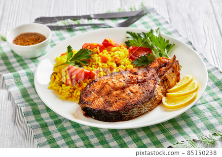 oven baked salmon steak with yellow rice oven baked salmon steak with yellow rice 85150238