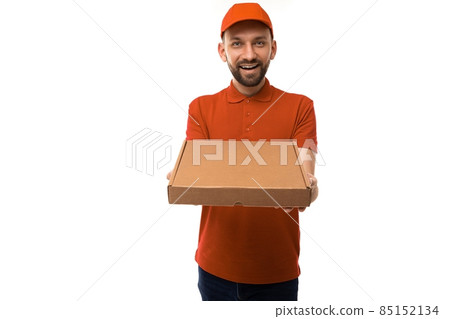 a pizza delivery courier holds out a cardboard box, a bearded man in a red uniform 85152134