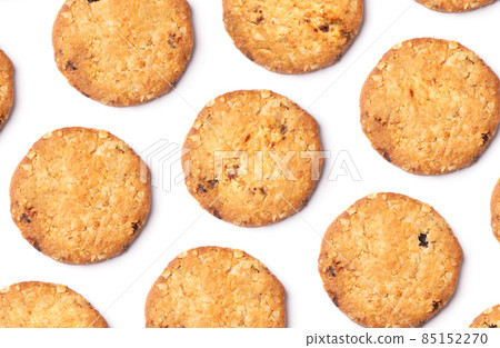 Pattern of vanilla chip butter cookies isolated on white background. Close-up view of brown crackers. Macro shot of yellow biscuit cake leftovers for your design Pattern of vanilla chip butter cookies isolated on white background. Close-up view of brown crackers. Macro shot of yellow biscuit cake leftovers for your design 85152270