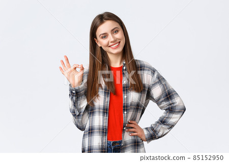 Lifestyle, different emotions, leisure activities concept. Confident beautiful young woman say no problem, guarantee quality, show okay sign, tilt head and smiling pleased, satisfied good result Lifestyle, different emotions, leisure activities concept. Confident beautiful young woman say no problem, guarantee quality, show okay sign, tilt head and smiling pleased, satisfied good result 85152950