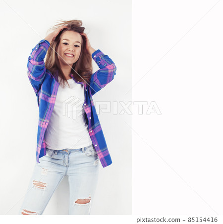 young pretty brunette real girl hipster on white background casual close up dreaming isolated smiling young pretty brunette real girl hipster on white background casual close up dreaming isolated smiling 85154416