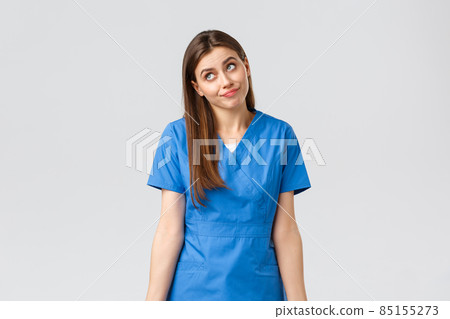 Healthcare workers, prevent virus, insurance and medicine concept. Indecisive and unsure cute doctor, female nurse in blue scrubs, cant tell, have no idea, shrugging and look away uncertain Healthcare workers, prevent virus, insurance and medicine concept. Indecisive and unsure cute doctor, female nurse in blue scrubs, cant tell, have no idea, shrugging and look away uncertain 85155273