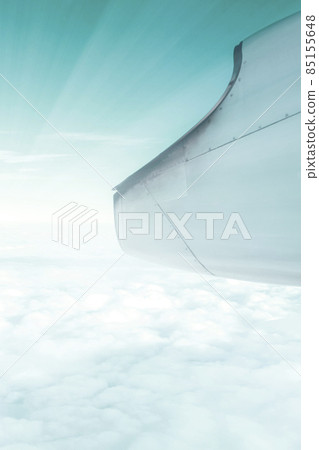 A wonderful view from the window of an airplane: Green sky and sunshine A wonderful view from the window of an airplane: Green sky and sunshine 85155648