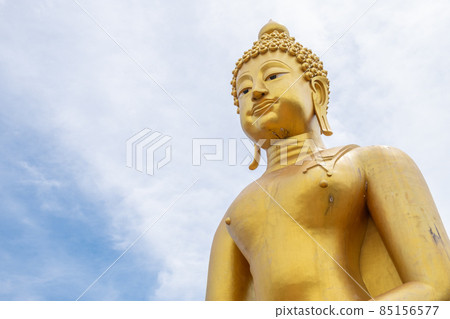 Golden Buddha in Chiang Saen style in Phutthamonthon (Buddhist park) build to celebrate its 750th anniversary of Chiang Rai ancient city.  85156577