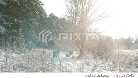 4K Re-enactors Dressed As World War II German Wehrmacht Infantry Soldiers Driving Old Tricar, Three-wheeled Motorcycle in Winter Snowy Forest 4K Re-enactors Dressed As World War II German Wehrmacht Infantry Soldiers Driving Old Tricar, Three-wheeled Motorcycle in Winter Snowy Forest 85157542