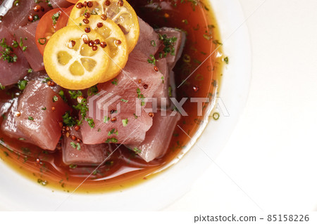 Tuna ceviche macro close up top view on white plate Tuna ceviche macro close up top view on white plate 85158226