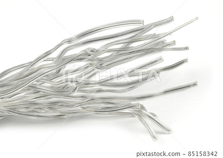 White plastic coated wire tie used for a variety of things on white background. White plastic coated wire tie used for a variety of things on white background. 85158342