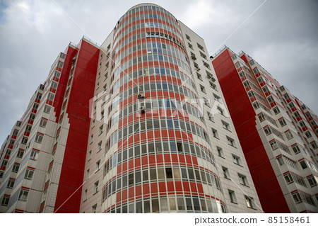 Multi storey building faced with colorful tiles. Multi storey building faced with colorful tiles. 85158461