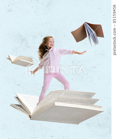 Contemporary art collage of little cheerful girl, child surfing on open book isolated over light blue background Contemporary art collage of little cheerful girl, child surfing on open book isolated over light blue background 85159456