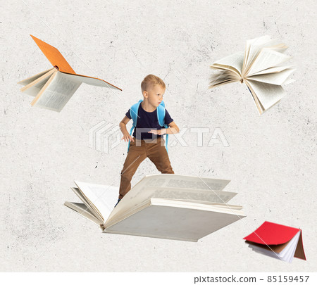 Contemporray art collage of little boy, child surfing on a book isolated over light textured background Contemporray art collage of little boy, child surfing on a book isolated over light textured background 85159457