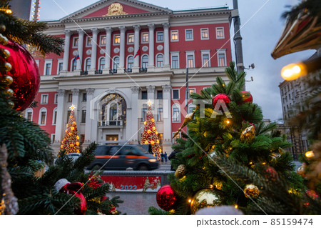 The building of the City Hall is decorated with 2 Christmas trees and opposite, on the square with a statue of Yuri Dolgoruky, there are also many Christmas trees, a carousel , tea The building of the City Hall is decorated with 2 Christmas trees and opposite, on the square with a statue of Yuri Dolgoruky, there are also many Christmas trees, a carousel , tea 85159474